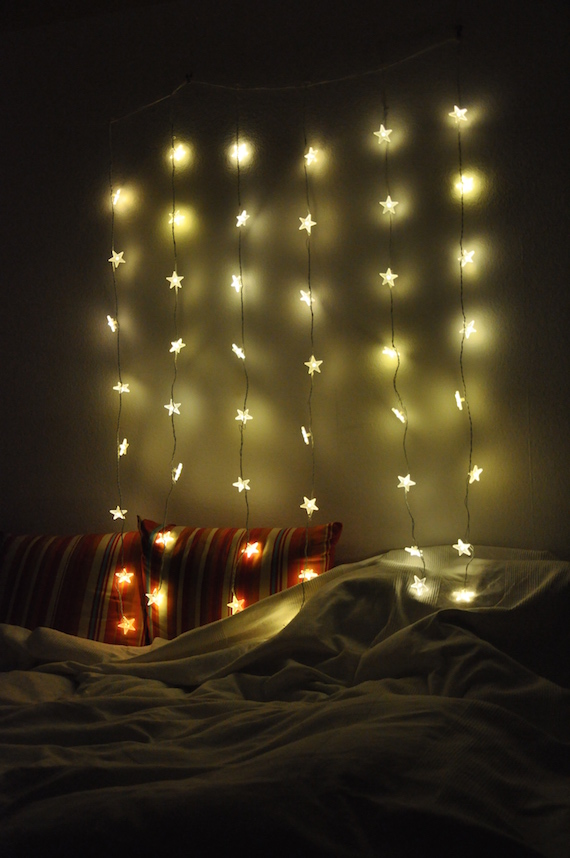 lighting which creates atmosphere over a cozy bed